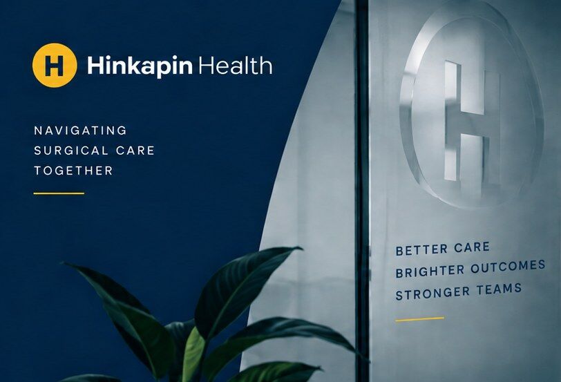 The Hinkapin Health office entrance, featuring the brand's H mark etched in glass