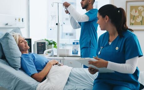 A care team supporting a patient during recovery
